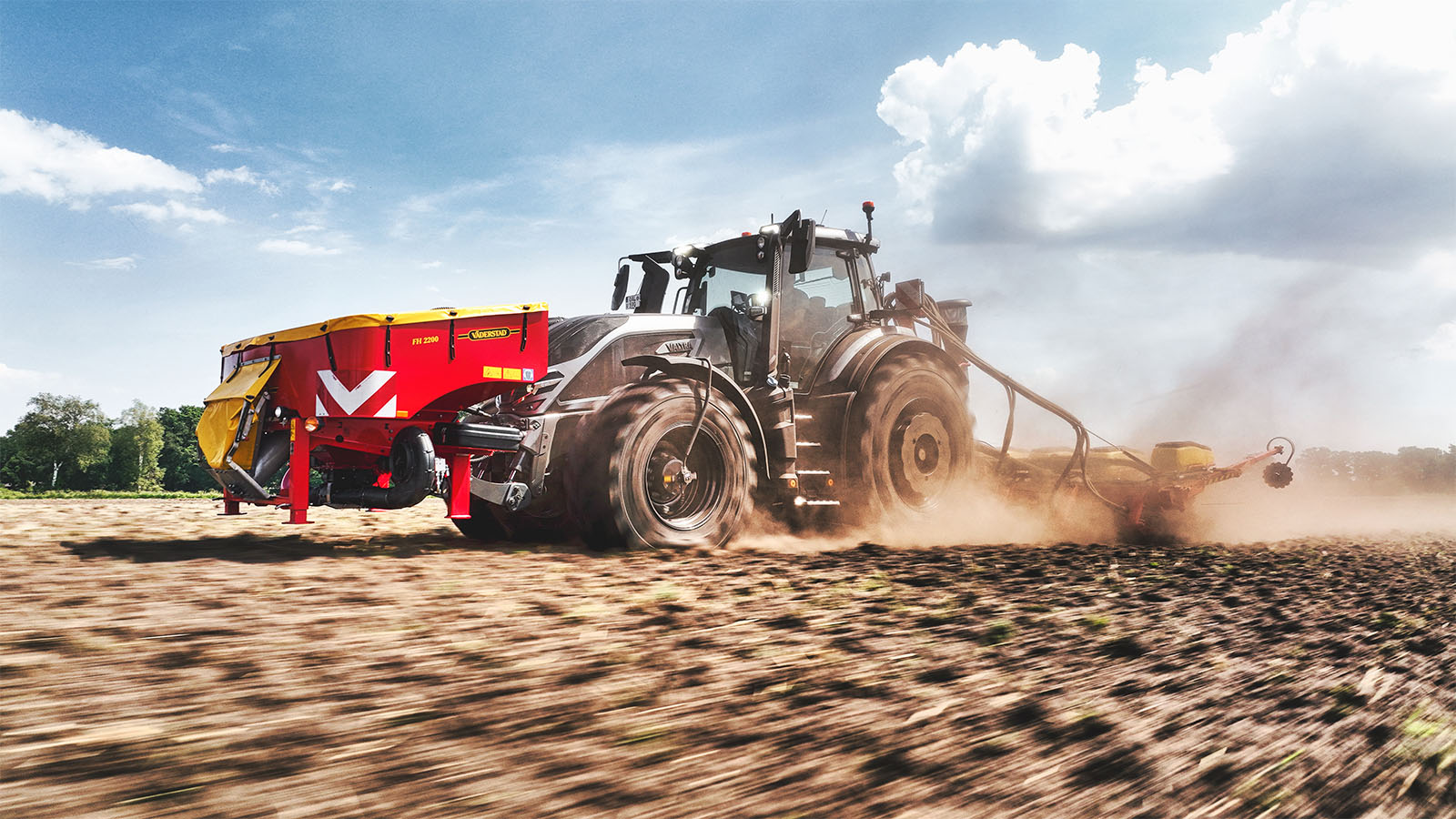 A Valtra Q Series tractor with Valtra Central Tyre Inflation System drilling seed with a Väderstad seed drill